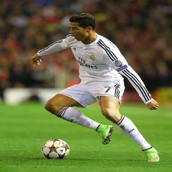 Cristiano Ronaldo in action dribbling opponent for Real Madrid